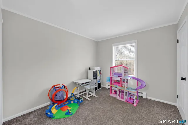 a room with toys and a wooden floor