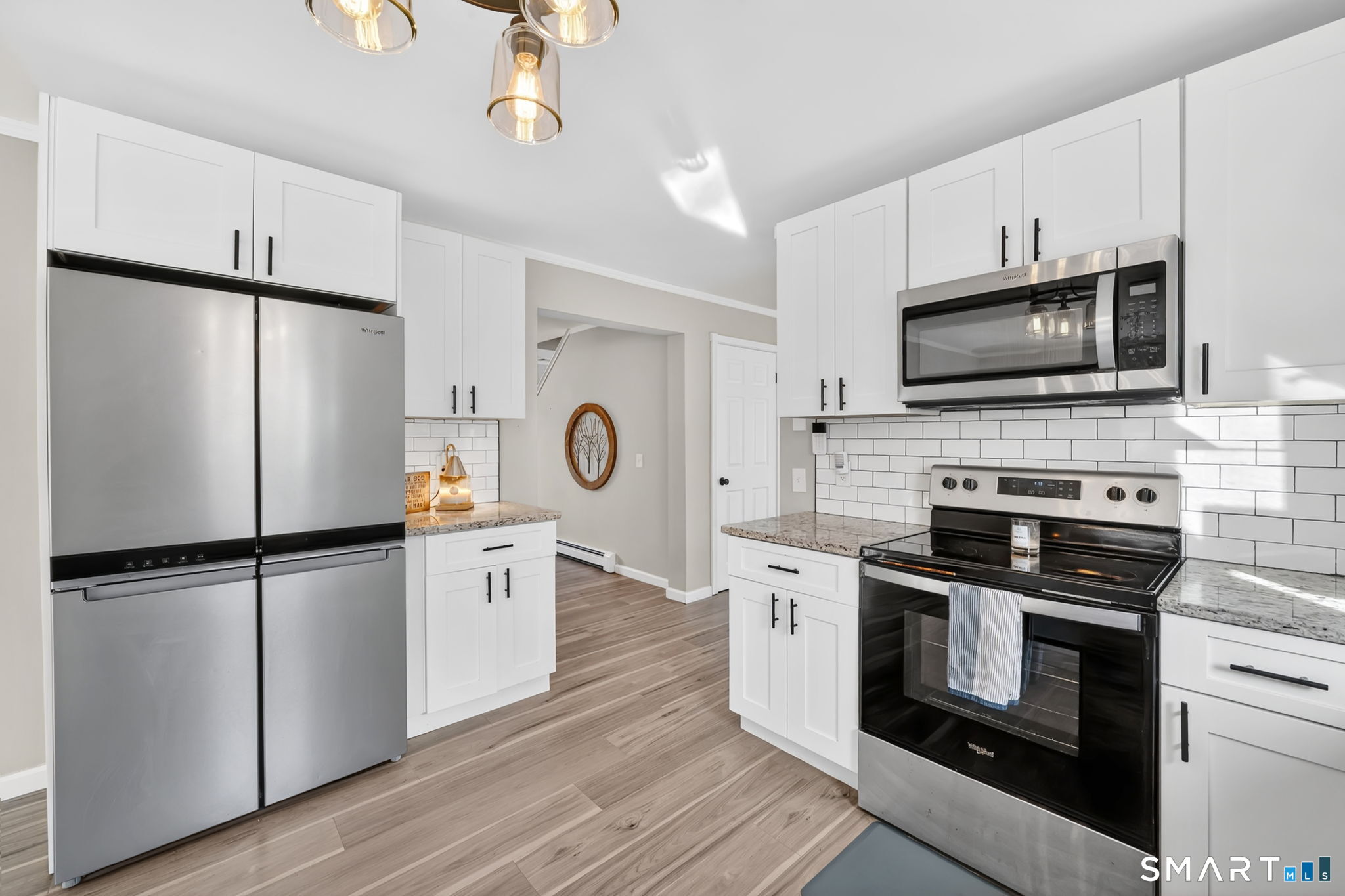 97 Bass Road Windham, CT 06280 - Photo 10 of 40 a kitchen with a refrigerator stove and microwave