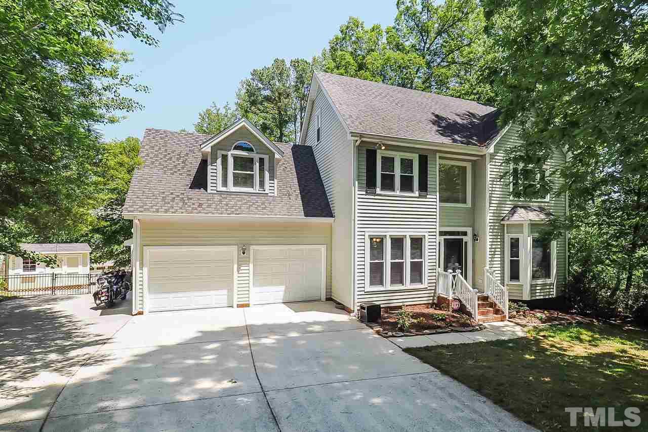 3309 Byers Drive Raleigh, NC 27607 - Photo 1 of 25 Picture is shot from cul de sac. Two car garage with additional parking pad to left. Workshop and additional storage in back of garage.