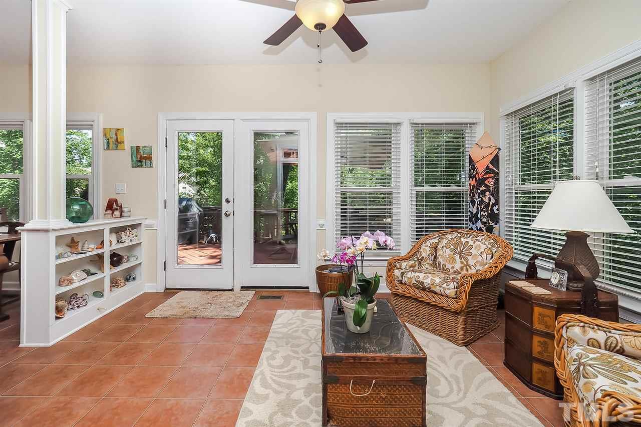 3309 Byers Drive Raleigh, NC 27607 - Photo 4 of 25 sun room and door to the deck. Sun room is open to kitchen.