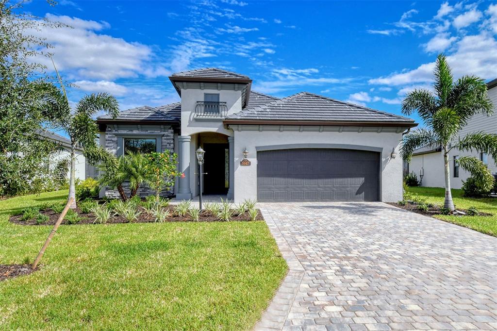 5947 Brandon Run Lakewood Ranch, FL 34211 - Photo 1 of 1 a front view of a house with a yard and garage
