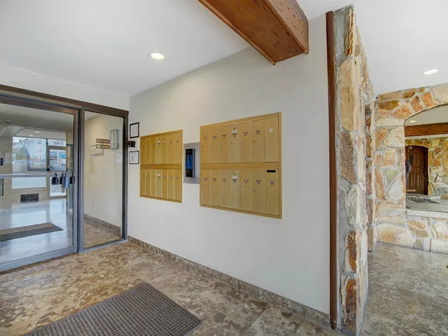 a view of front door with yard and furniture