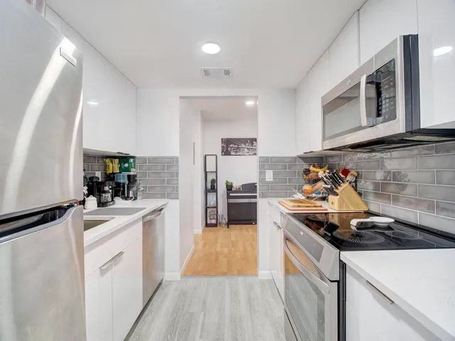 a kitchen with a stove and a sink