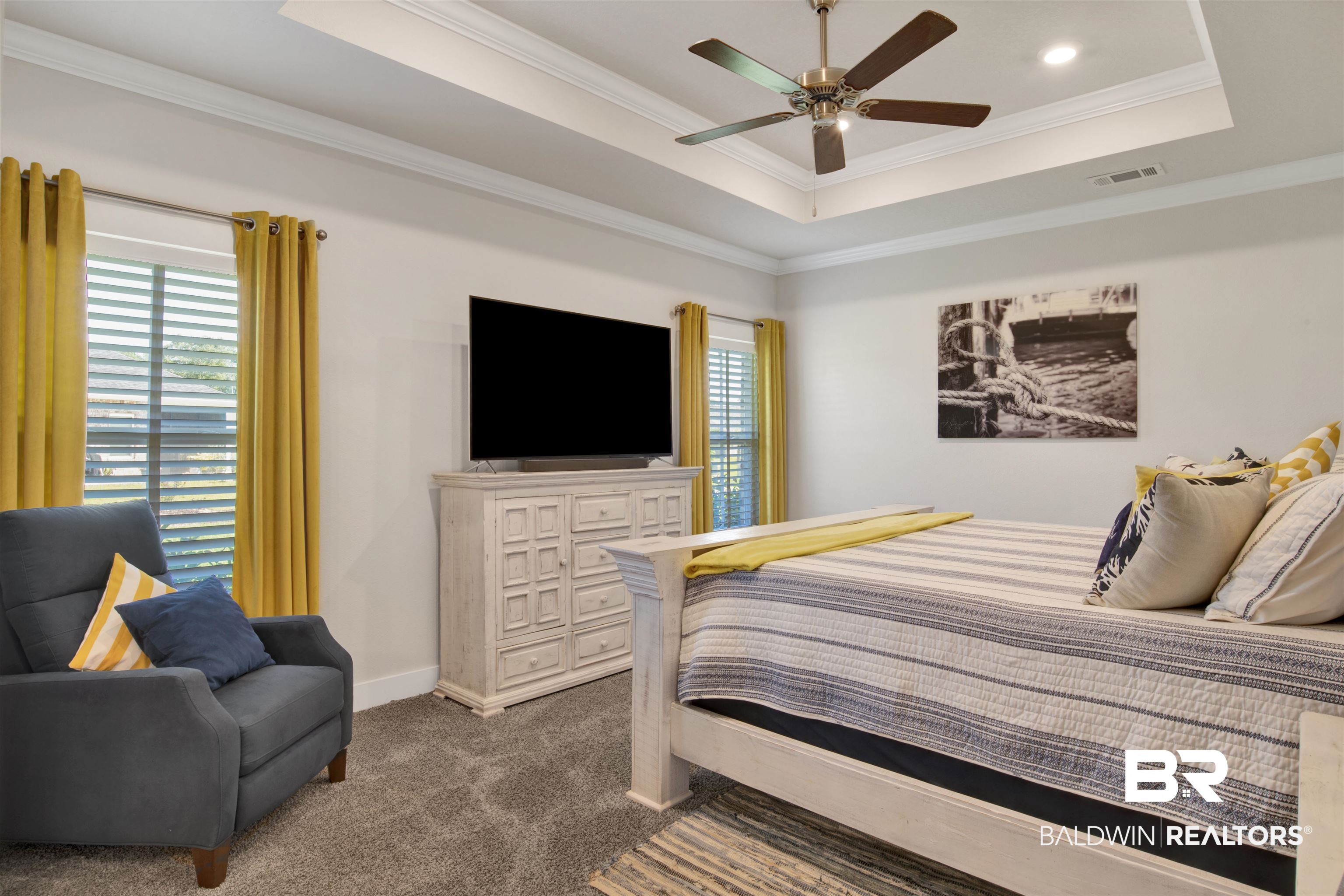 10113 Lakeview Drive Foley, AL 36535 - Photo 19 of 34 Carpeted bedroom featuring crown molding, ceiling fan, and a raised ceiling