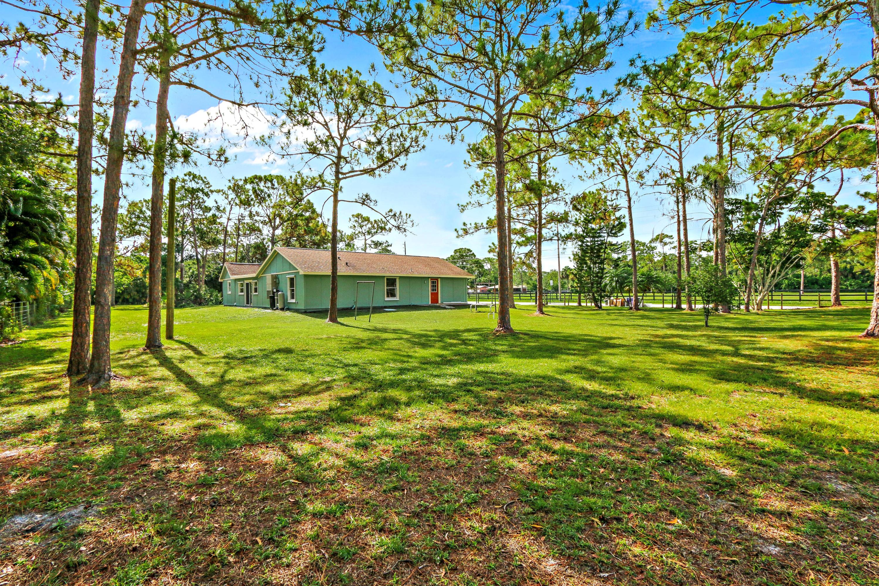 12499 Sandy Run Road Jupiter, FL 33478 - Photo 18 of 21 a view of a park with large trees