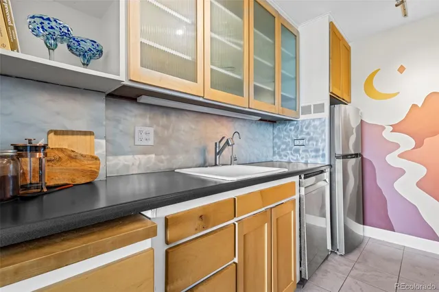 a kitchen with stainless steel appliances granite countertop a sink and a microwave