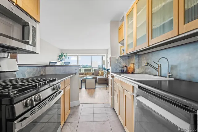 a kitchen with a stove and a sink