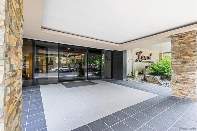 a view of a patio with table and chairs and potted plants
