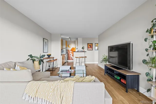 a bedroom with furniture and a flat screen tv