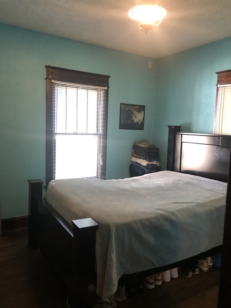 300 North Maple Street Normal, IL 61761 - Photo 12 of 18 a bedroom with a bed and window