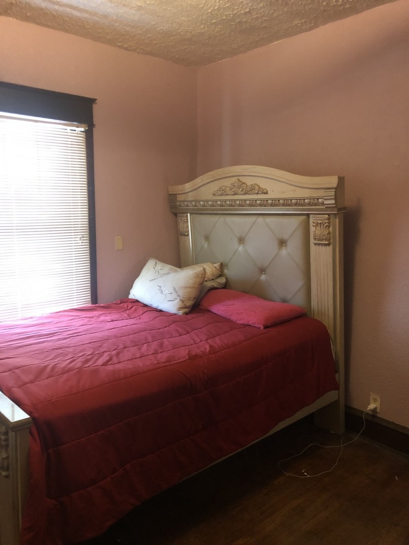 300 North Maple Street Normal, IL 61761 - Photo 13 of 18 a bedroom with a bed and a window