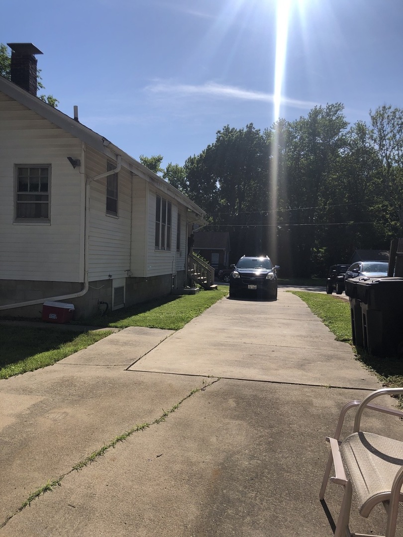 300 North Maple Street Normal, IL 61761 - Photo 17 of 18 a white house with a yard