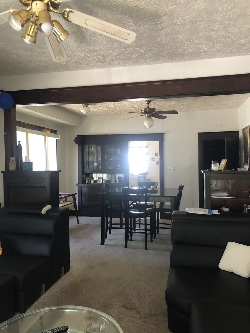 300 North Maple Street Normal, IL 61761 - Photo 5 of 18 a living room with furniture and a large window