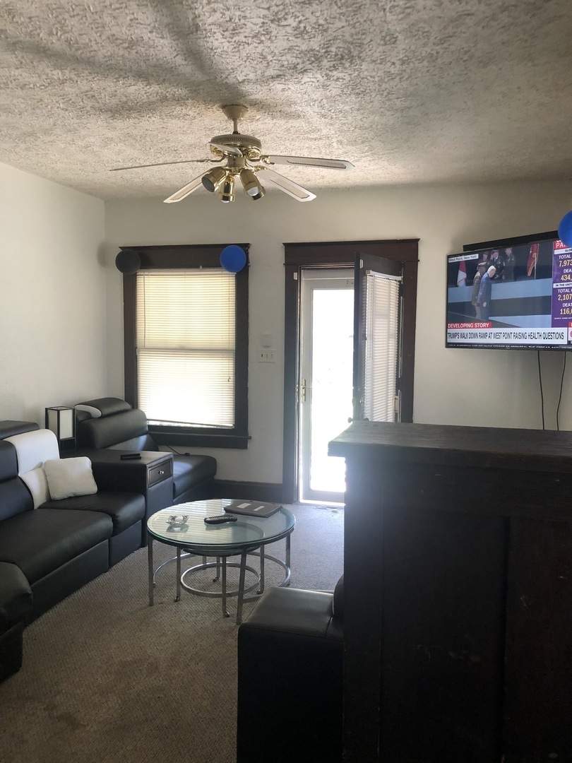 300 North Maple Street Normal, IL 61761 - Photo 6 of 18 a living room with furniture and a window
