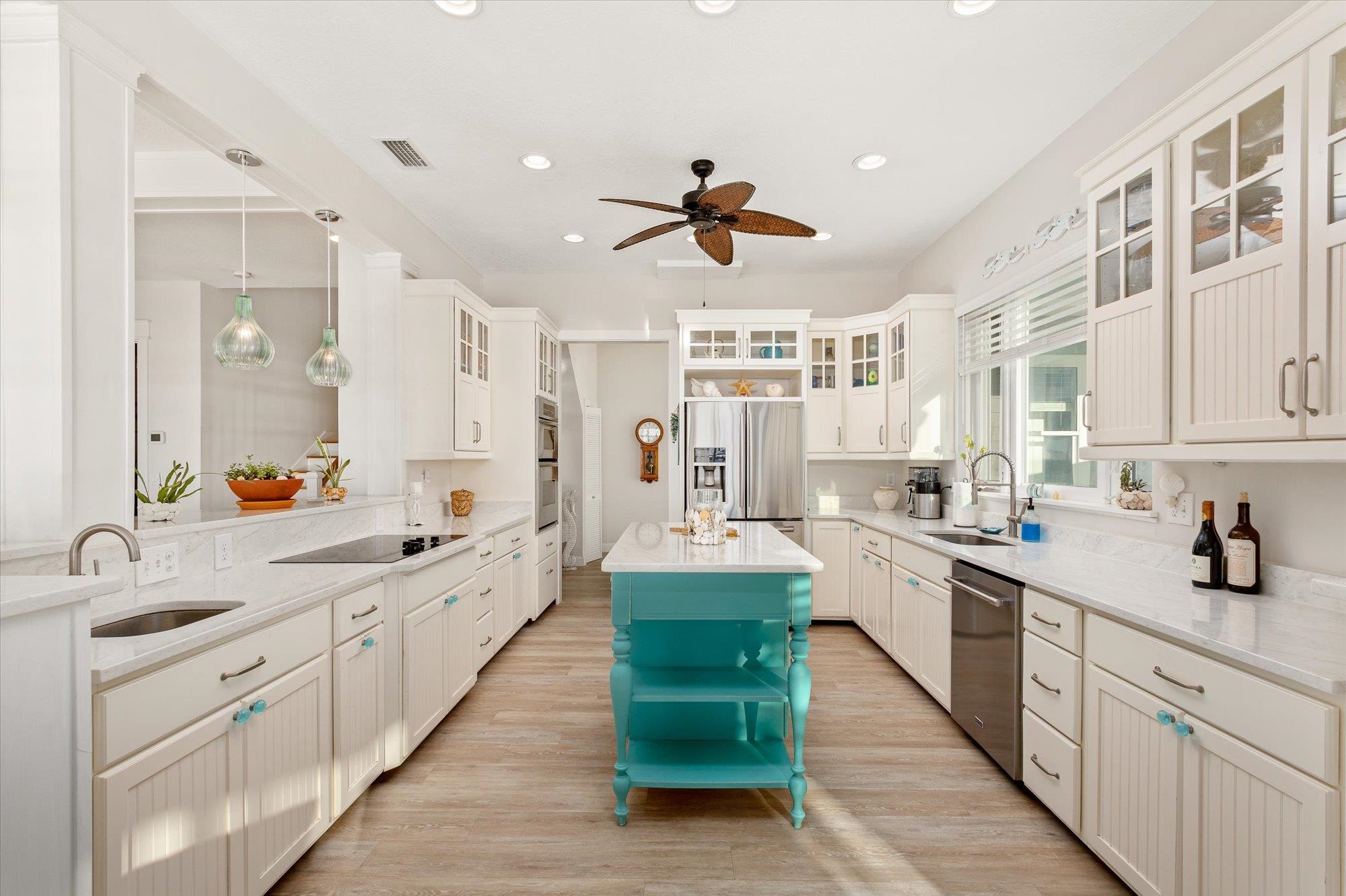 345 Micklers Road St. Augustine, FL 32080 - Photo 16 of 100 a large open kitchen with a large window and stainless steel appliances