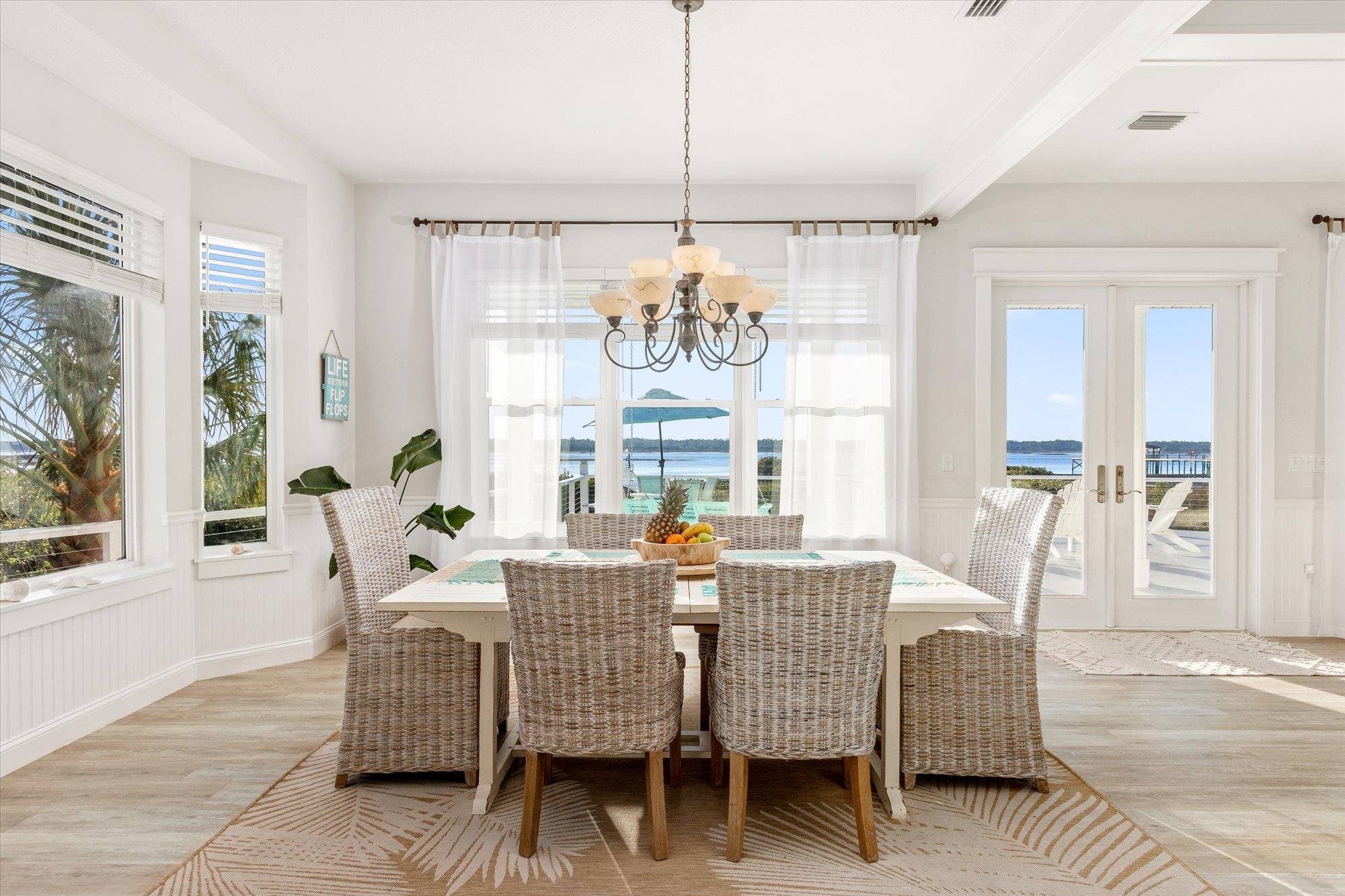 345 Micklers Road St. Augustine, FL 32080 - Photo 20 of 100 a view of a dining room with furniture window and wooden floor
