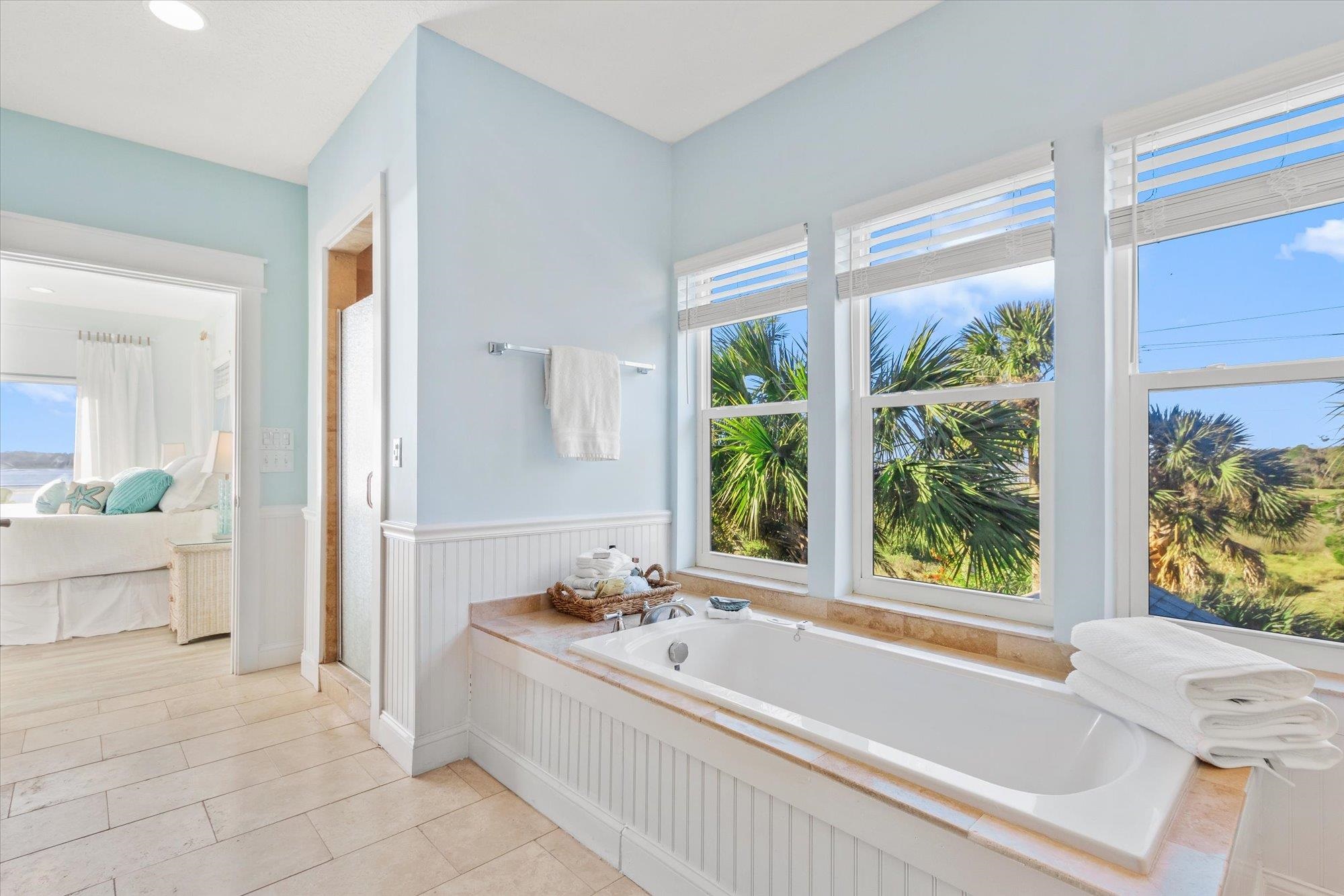 345 Micklers Road St. Augustine, FL 32080 - Photo 28 of 100 a large white tub sitting in a bathroom next to a window