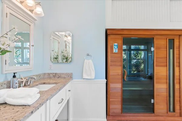 a pathway of a house with a yard