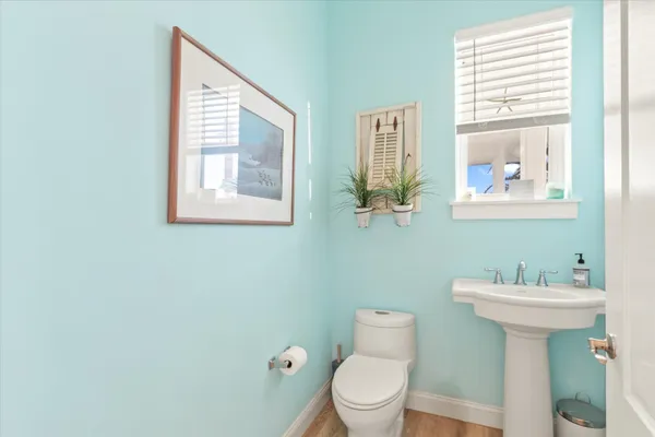 a dining room with furniture and a floor to ceiling window