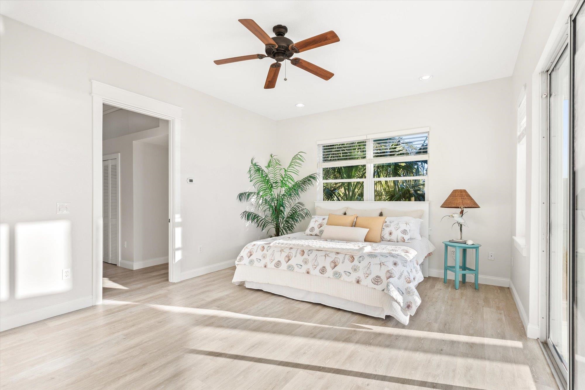 345 Micklers Road St. Augustine, FL 32080 - Photo 47 of 100 a bedroom with a large bed and a window