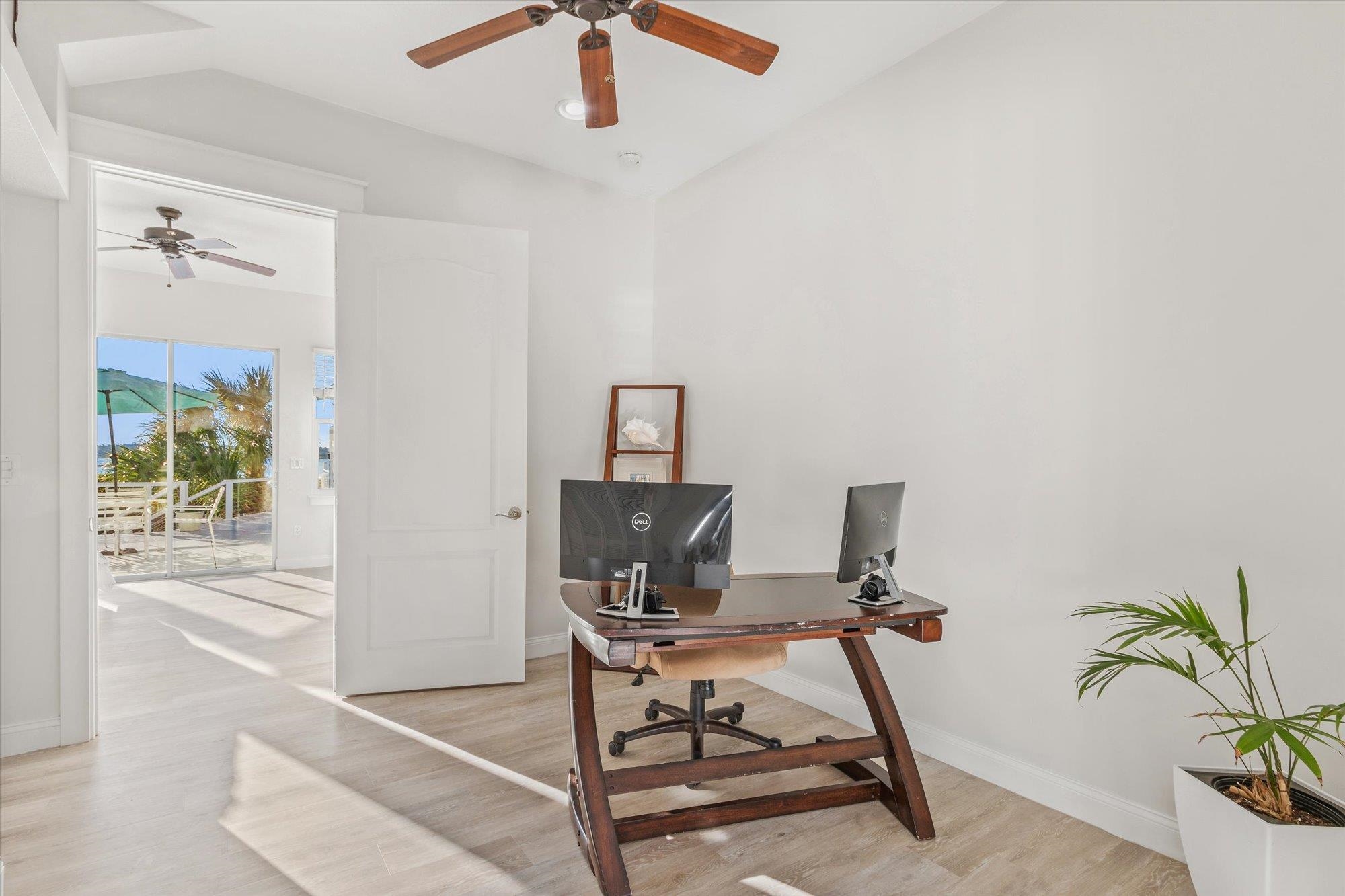 345 Micklers Road St. Augustine, FL 32080 - Photo 50 of 100 a view of a workspace with furniture and a window
