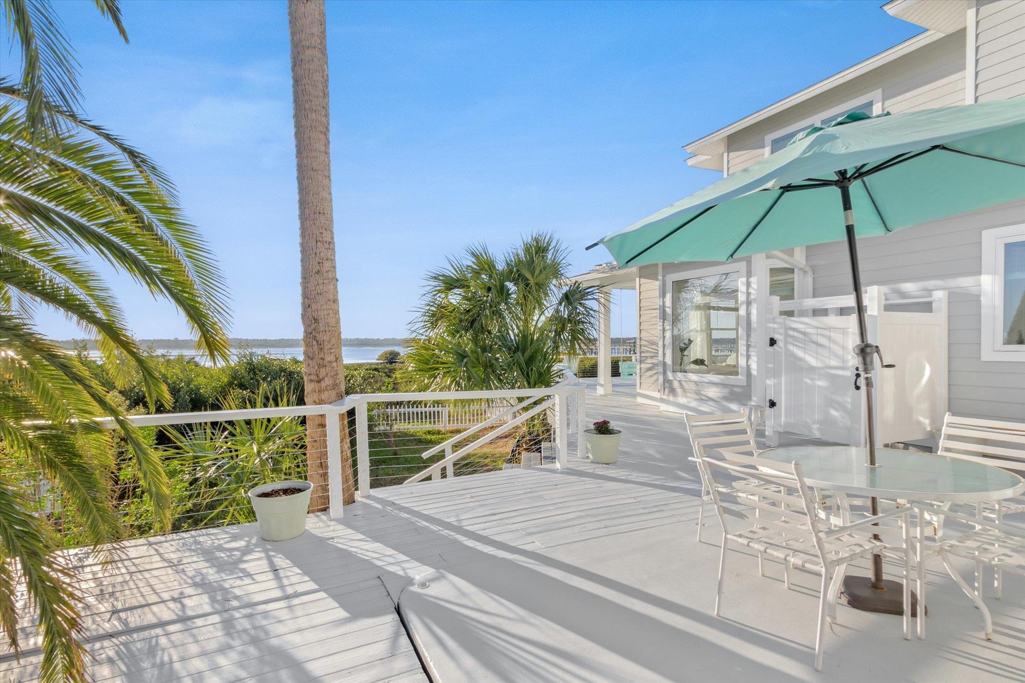 345 Micklers Road St. Augustine, FL 32080 - Photo 60 of 100 a view of house with wooden deck and furniture