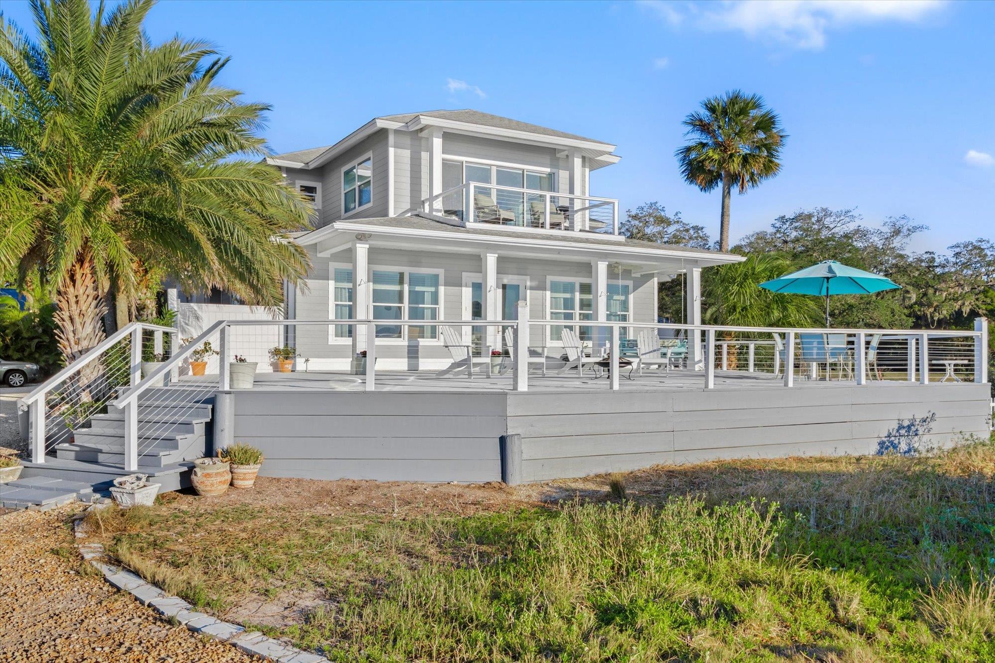 345 Micklers Road St. Augustine, FL 32080 - Photo 61 of 100 front view of a house with a swimming pool