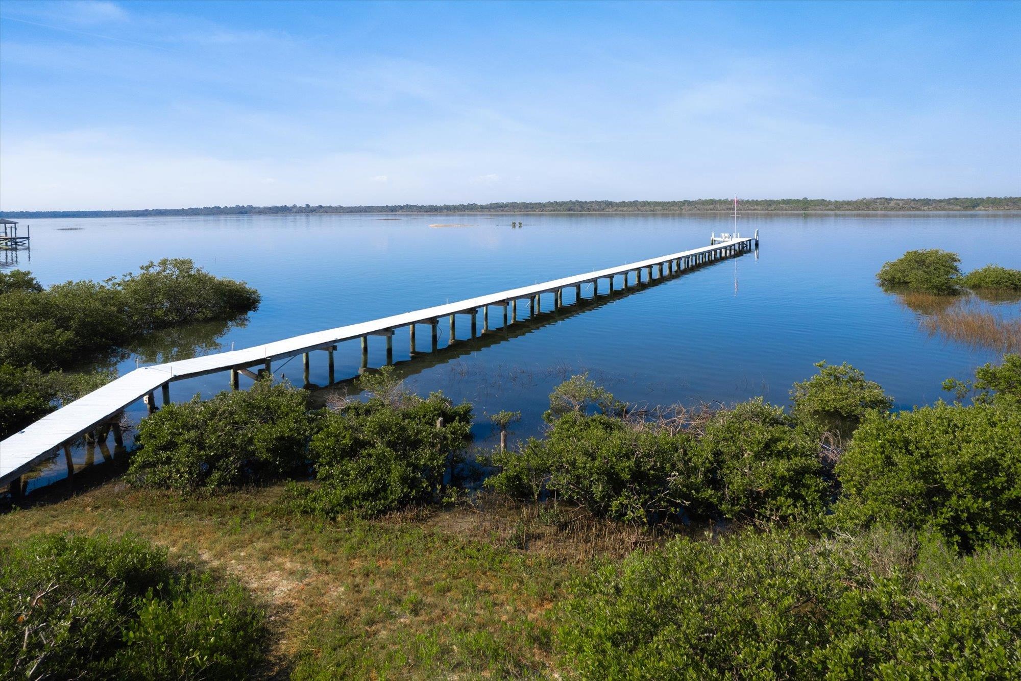 345 Micklers Road St. Augustine, FL 32080 - Photo 89 of 100 a view of a lake with a garden