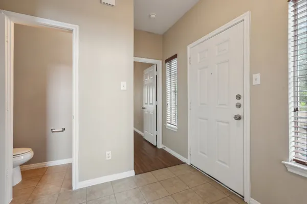a view of a bathroom with toilet front door