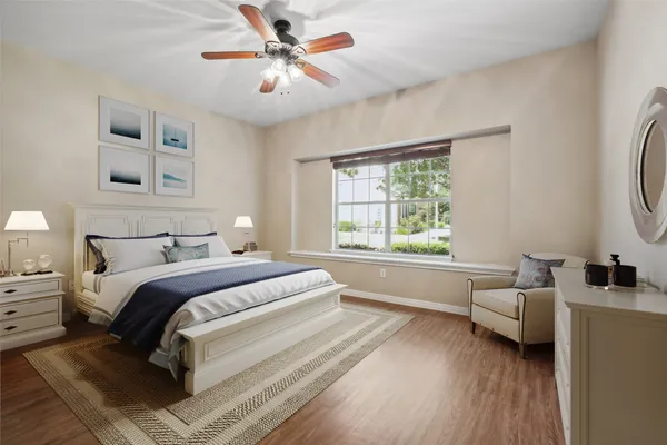 a spacious bedroom with a bed and a window