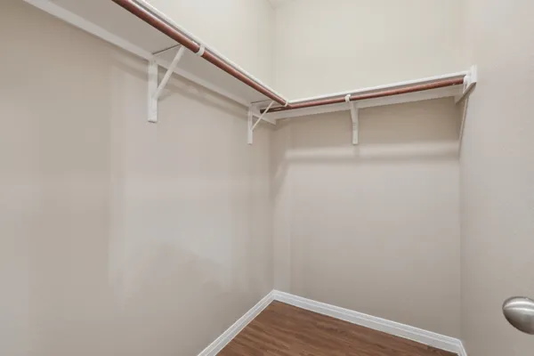 a view of a room with shelf on the wall