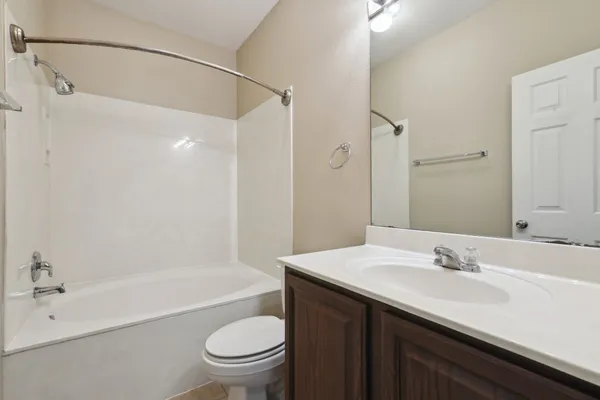a bathroom with a sink a toilet and a bathtub