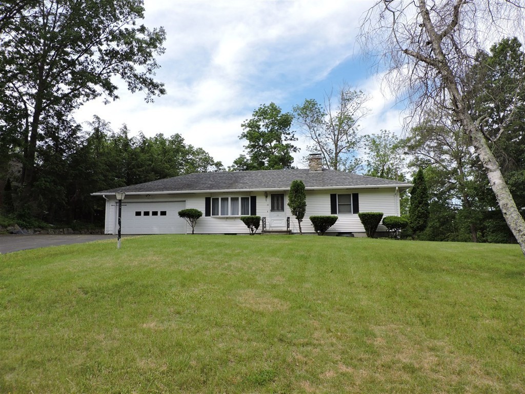 39 Cudworth Road Webster, MA 01570 - Photo 3 of 30 a view of a house with a big yard and large trees