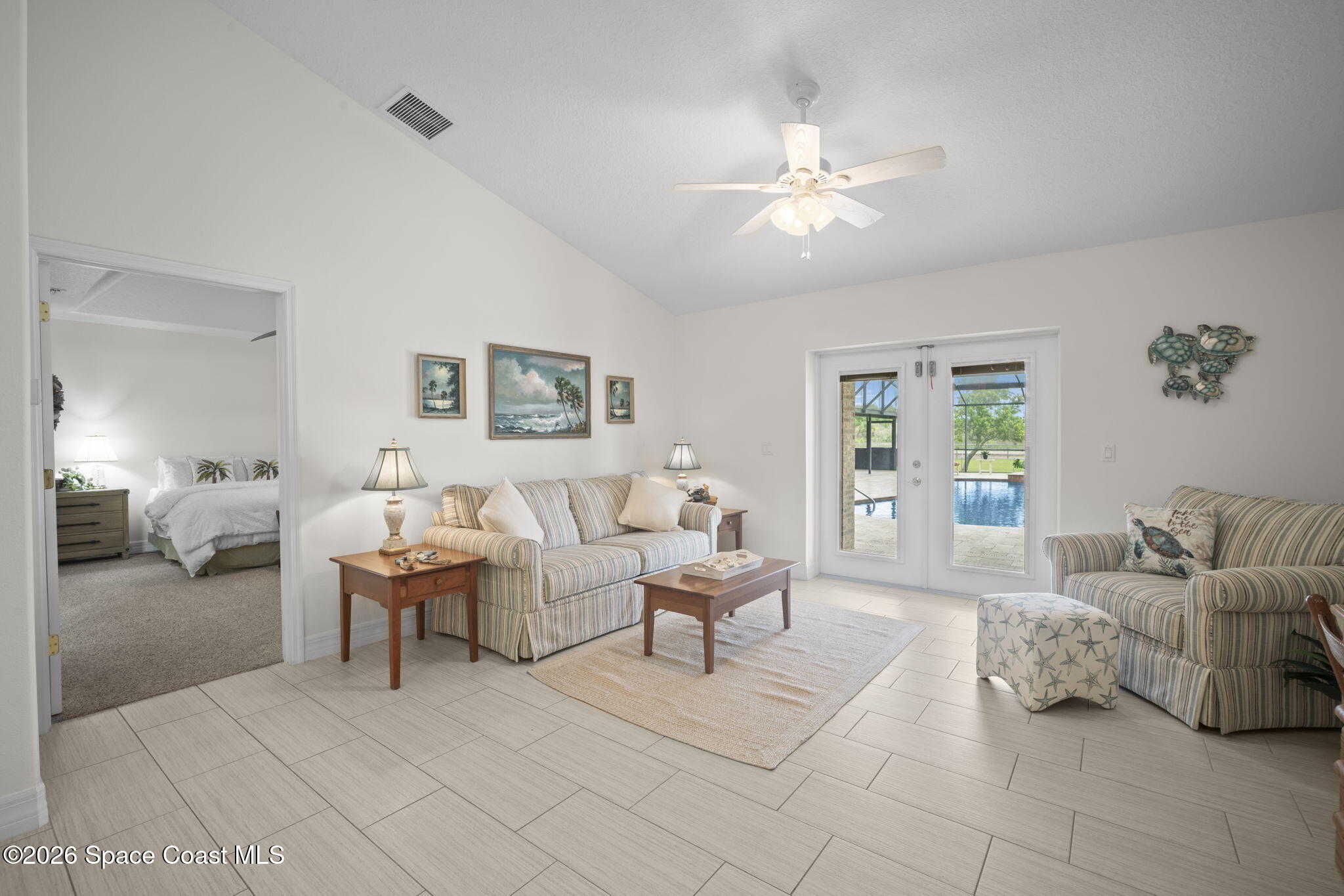 3125 Davis Road Mims, FL 32754 - Photo 37 of 47 a living room with furniture and a chandelier