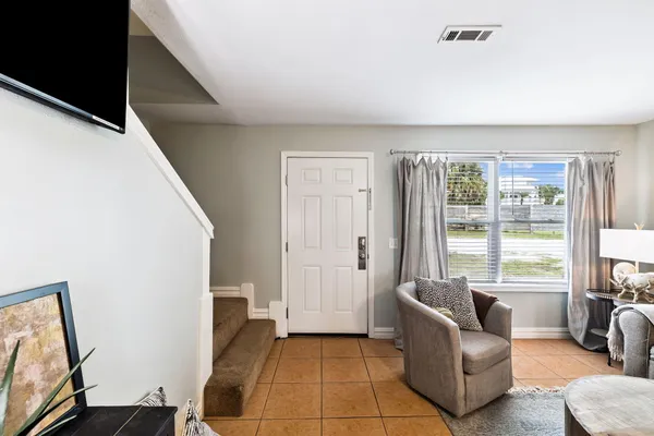 a living room with furniture and a window