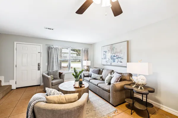 a bedroom with a bed and lamp
