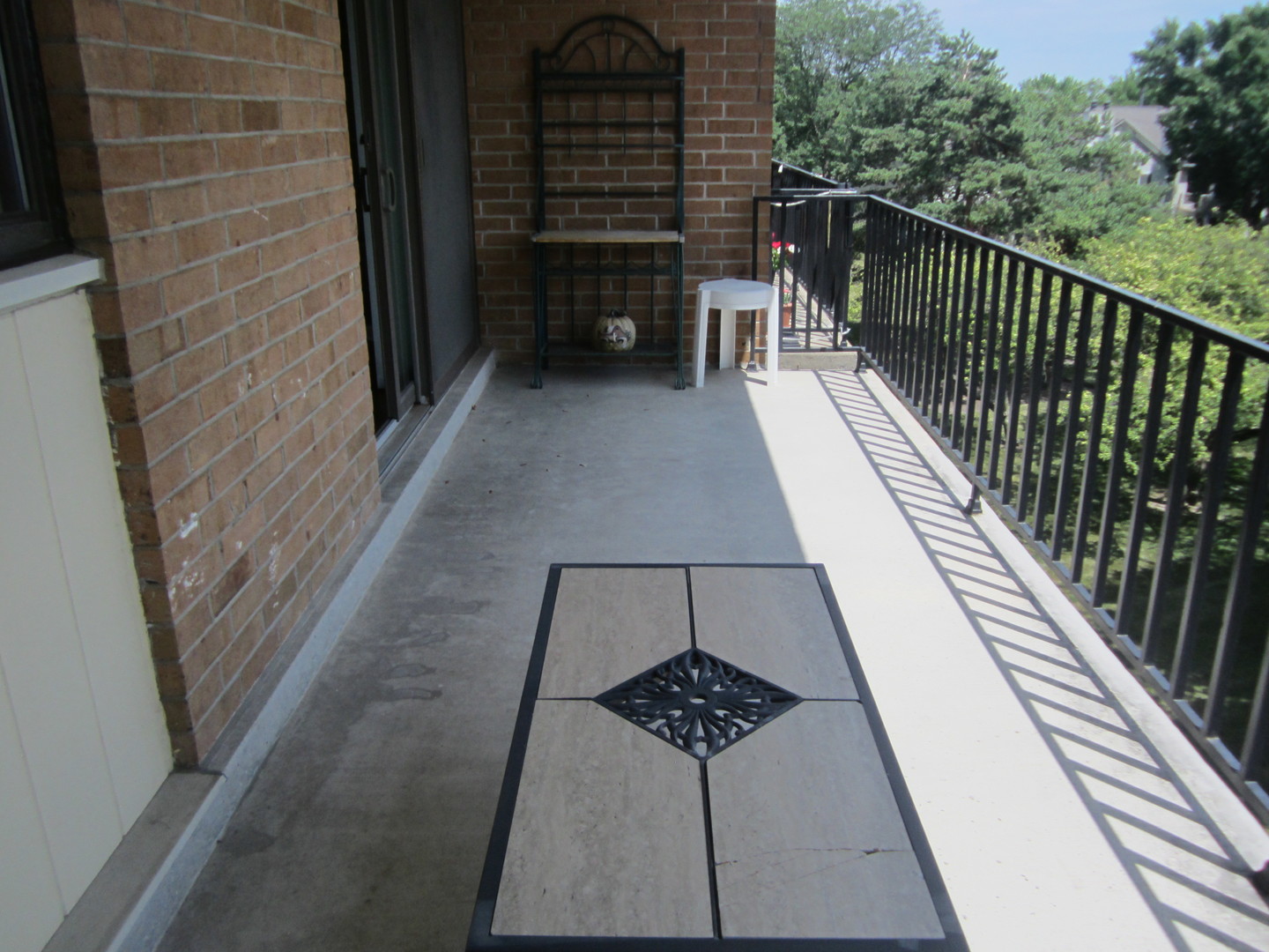 15 Bar Harbour Road, Unit 4G Schaumburg, IL 60193 - Photo 19 of 21 a view of a balcony with two chairs and a gate