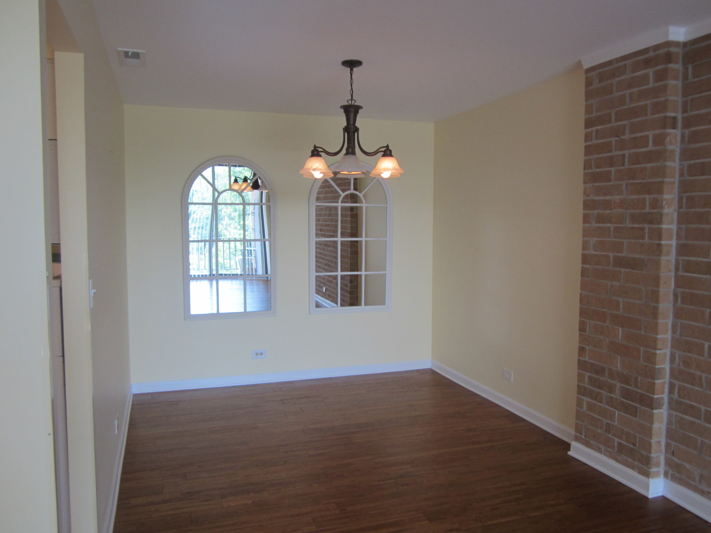 15 Bar Harbour Road, Unit 4G Schaumburg, IL 60193 - Photo 3 of 21 an empty room with wooden floor windows and entrance
