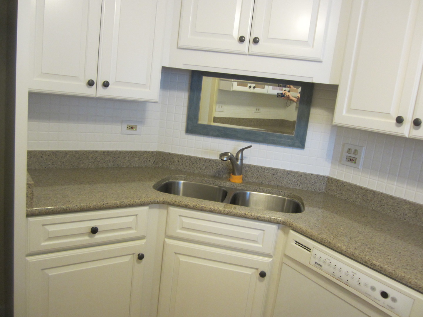 15 Bar Harbour Road, Unit 4G Schaumburg, IL 60193 - Photo 9 of 21 a kitchen with white cabinets and a sink
