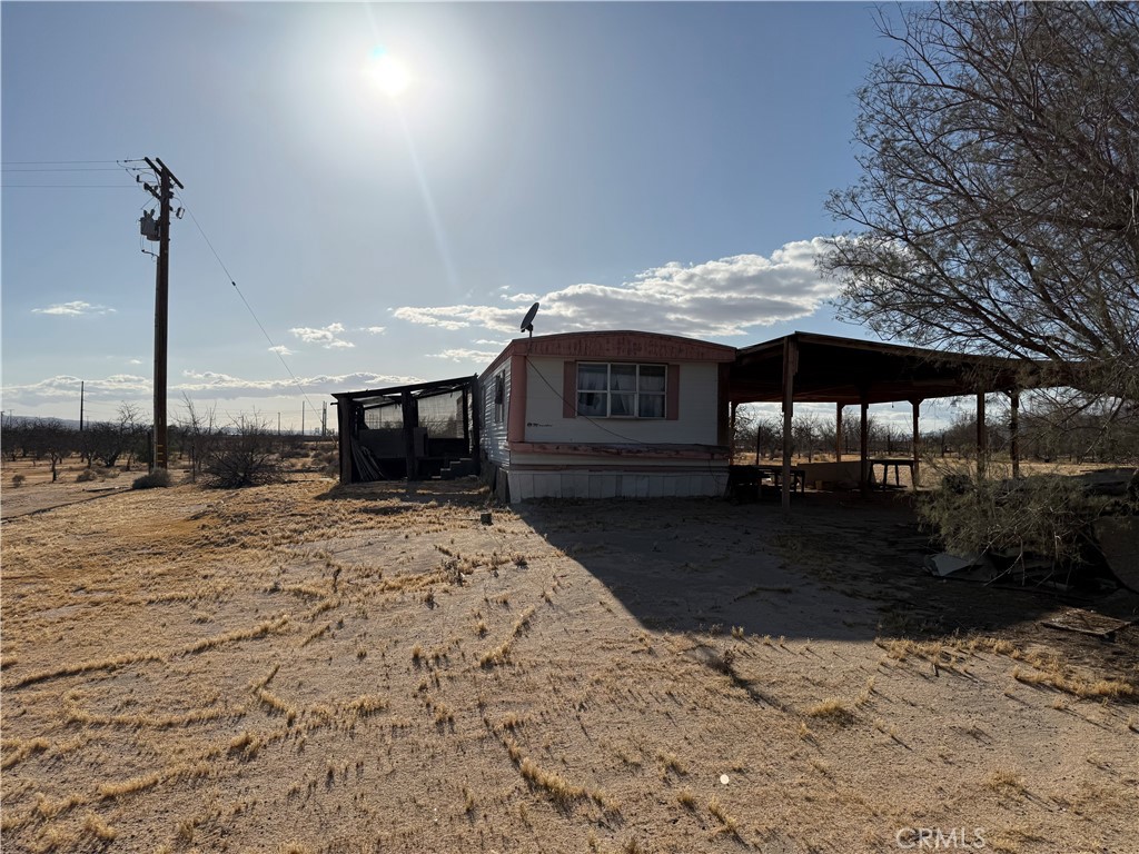 41854 Silver Valley Road Newberry Springs, CA 92365 - Photo 8 of 18 a view of a house with a yard