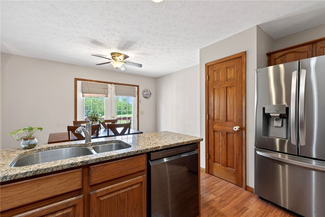 4996 Shannon Avenue Springfield, OH 45504 - Photo 30 of 61 This bright kitchen features a functional island and dining area, perfect for everyday meals.