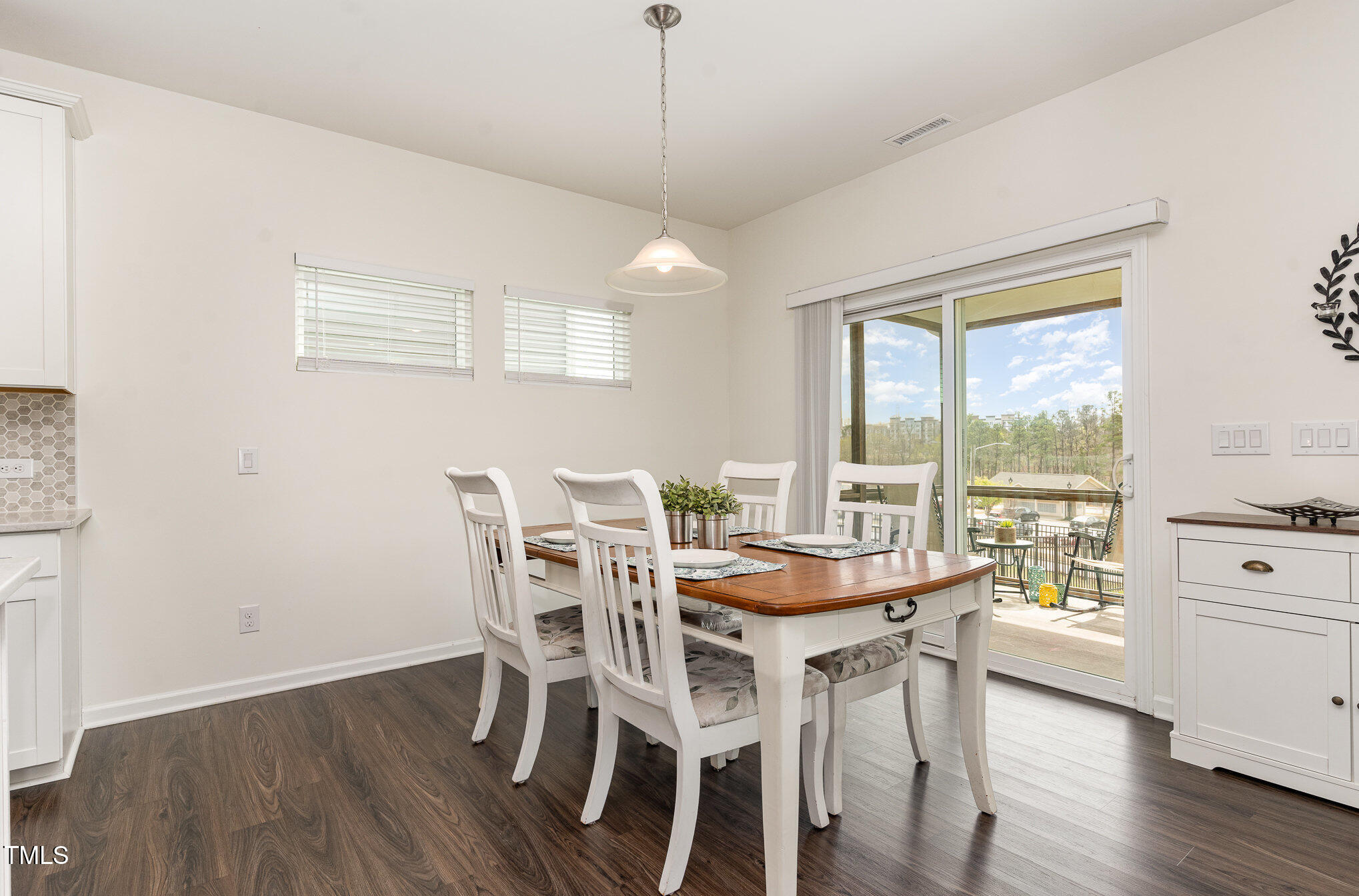 1040 Lippincott Road Durham, NC 27703 - Photo 12 of 43 a dining room with furniture window wooden floor