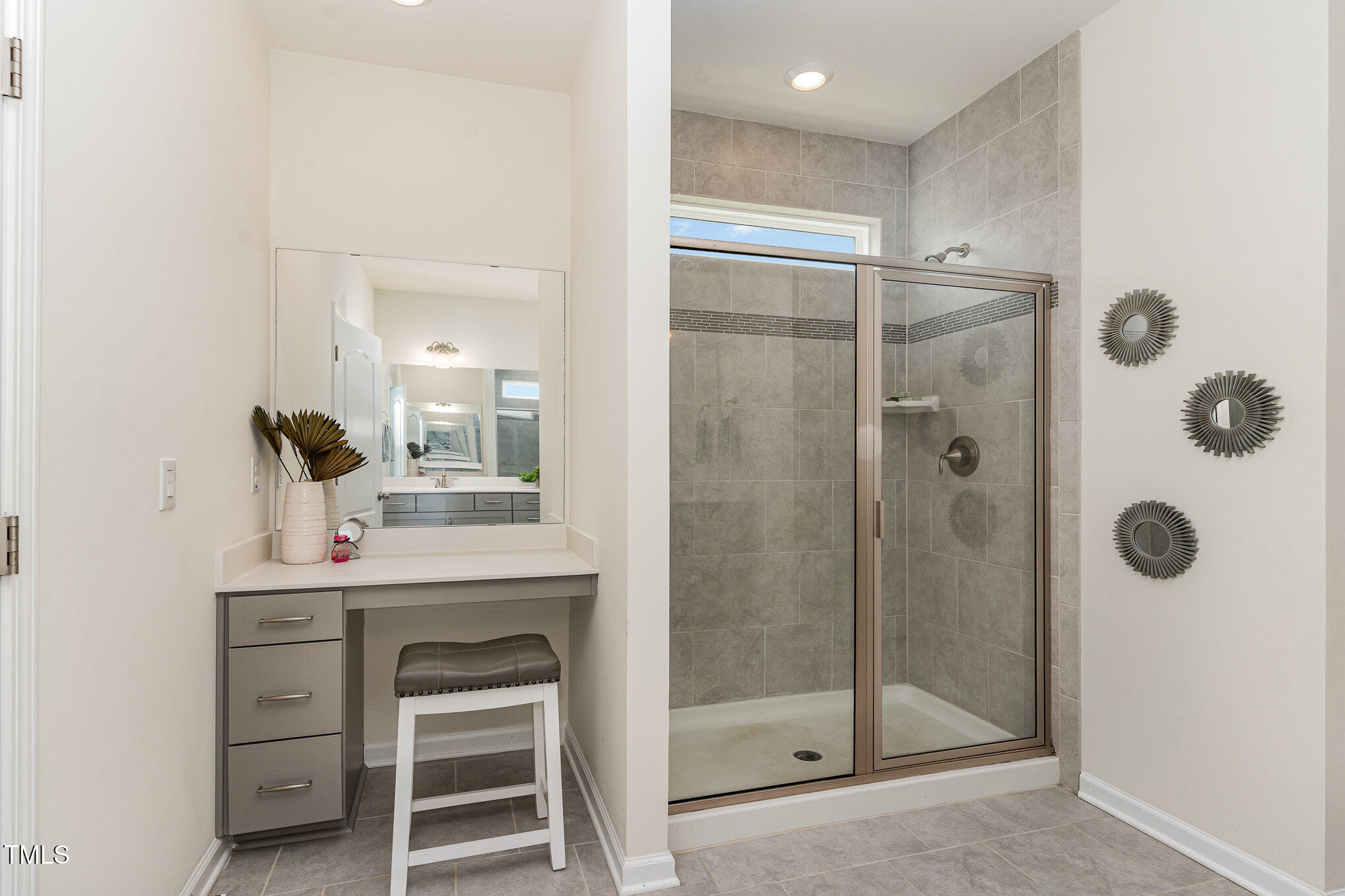 1040 Lippincott Road Durham, NC 27703 - Photo 22 of 43 a bathroom with a shower sink and mirror
