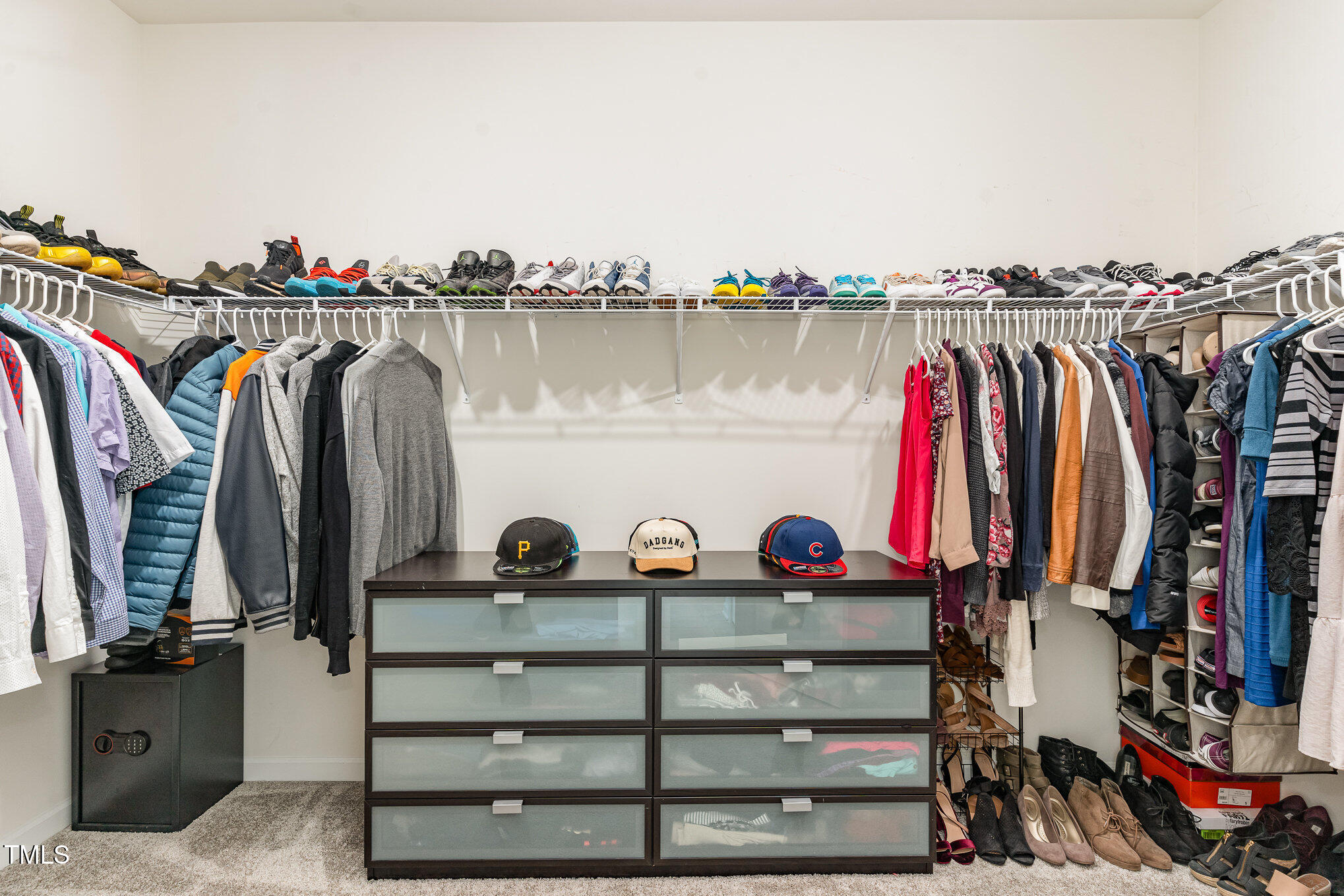 1040 Lippincott Road Durham, NC 27703 - Photo 23 of 43 a view of walk in closet with clothes and shoes