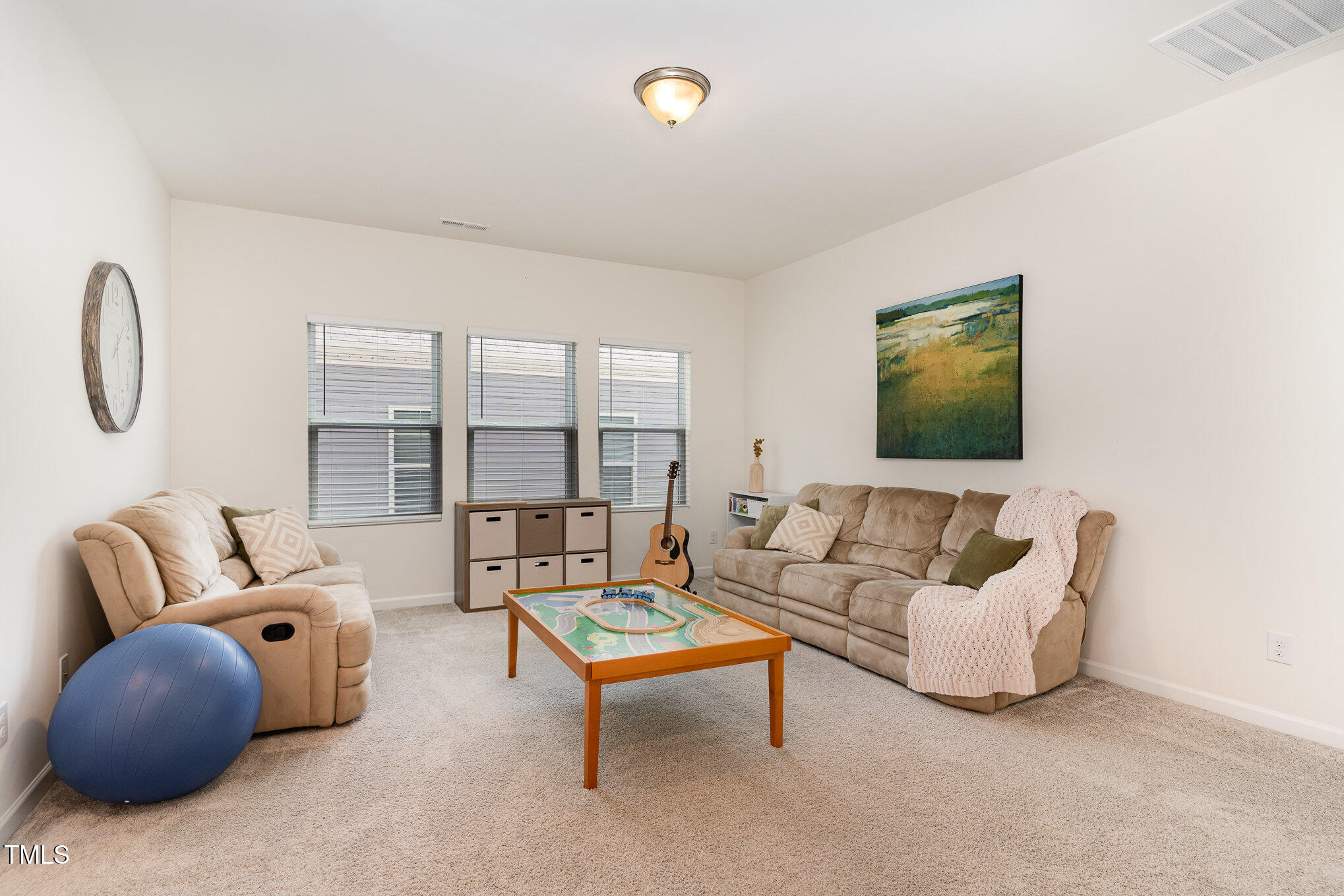 1040 Lippincott Road Durham, NC 27703 - Photo 24 of 43 a living room with furniture and a flat screen tv