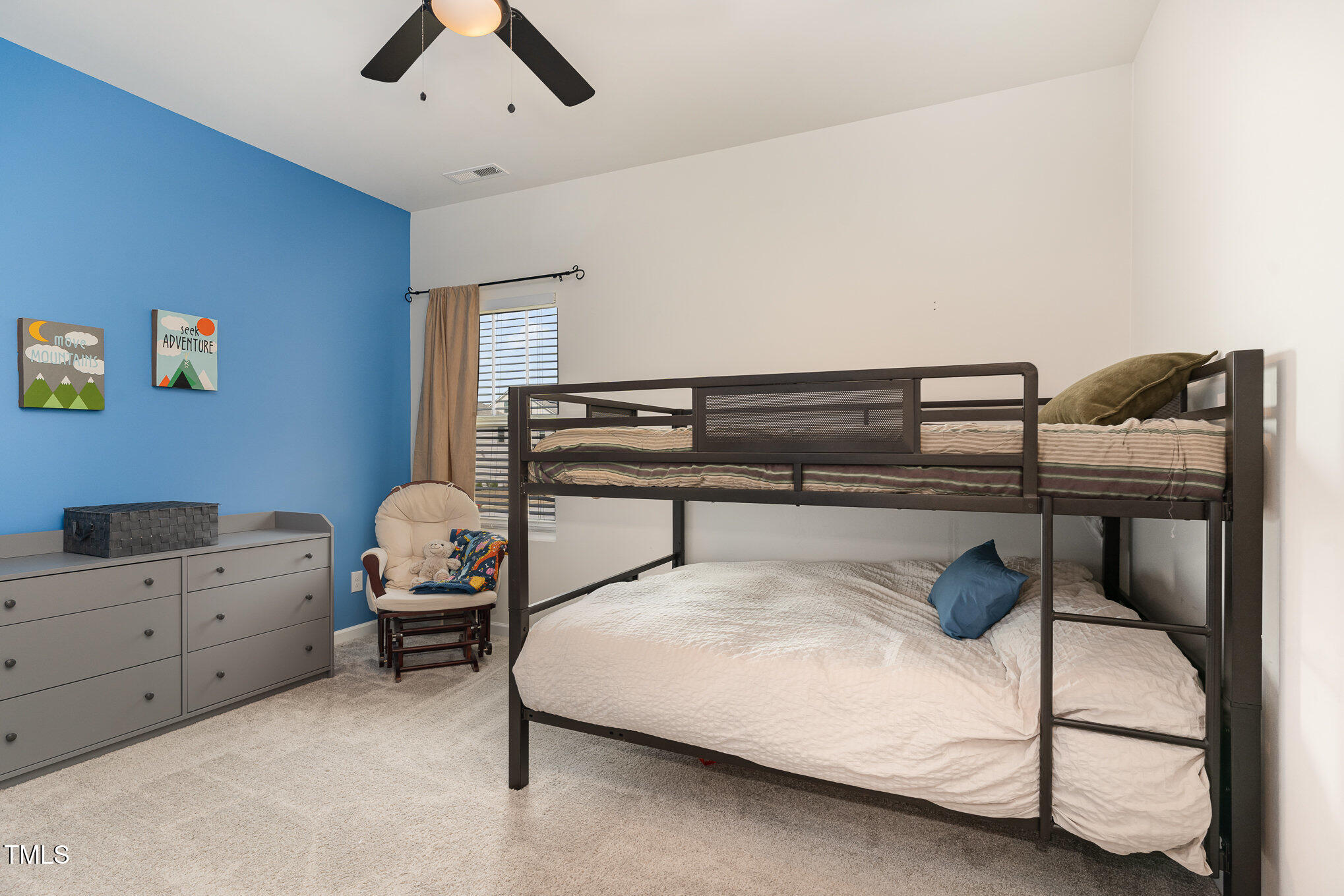 1040 Lippincott Road Durham, NC 27703 - Photo 25 of 43 a bedroom with a bed and a cabinets