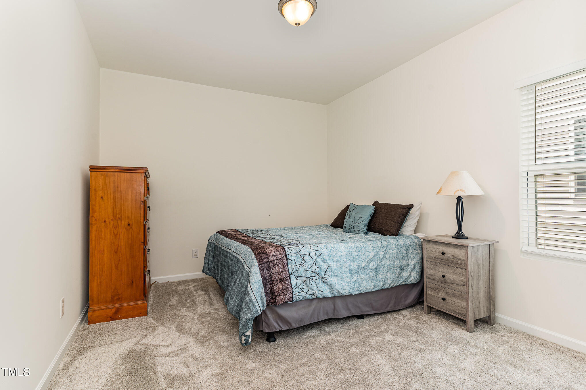 1040 Lippincott Road Durham, NC 27703 - Photo 27 of 43 a bedroom with a bed and a cabinets