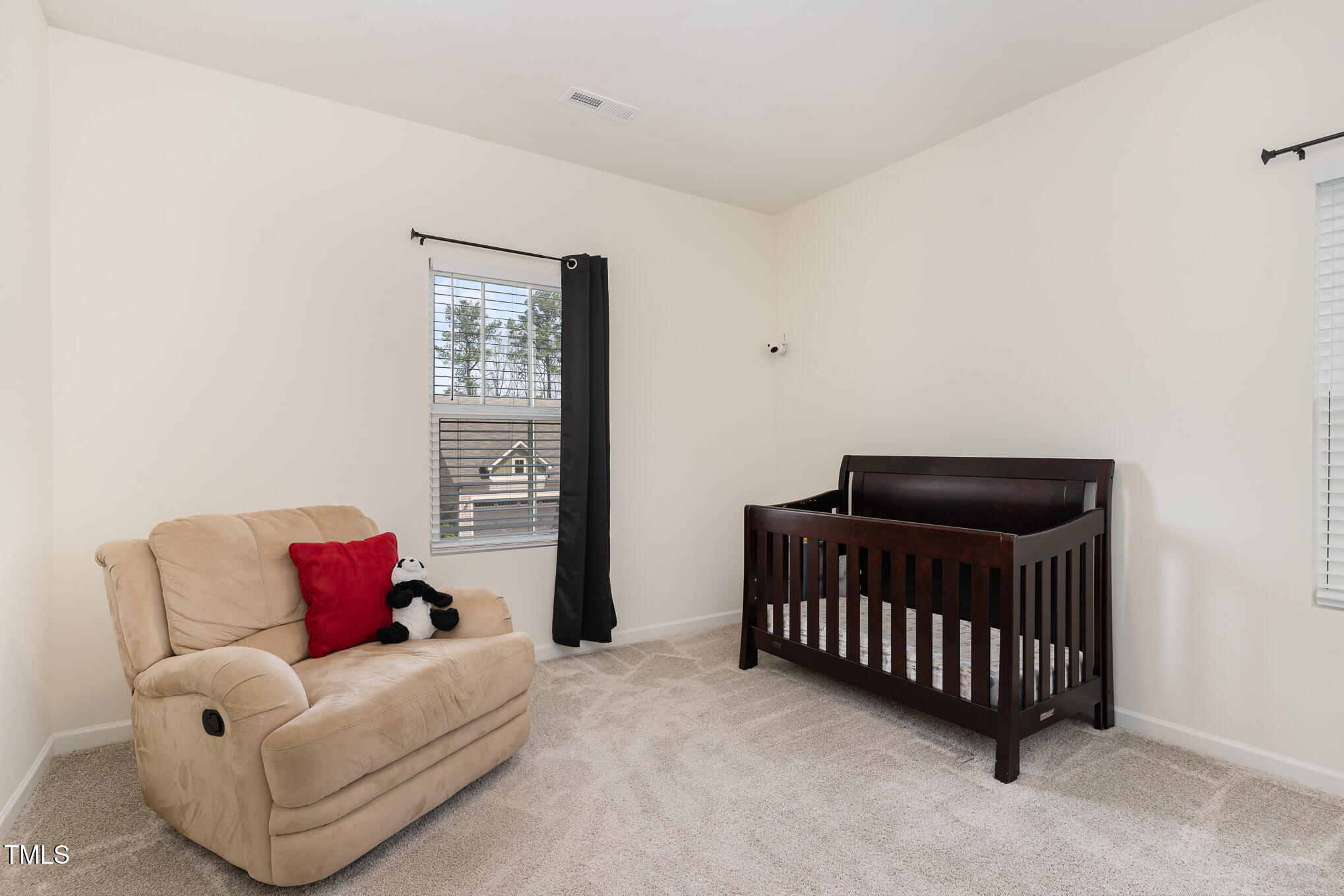 1040 Lippincott Road Durham, NC 27703 - Photo 28 of 43 a bedroom with a bed and a couch