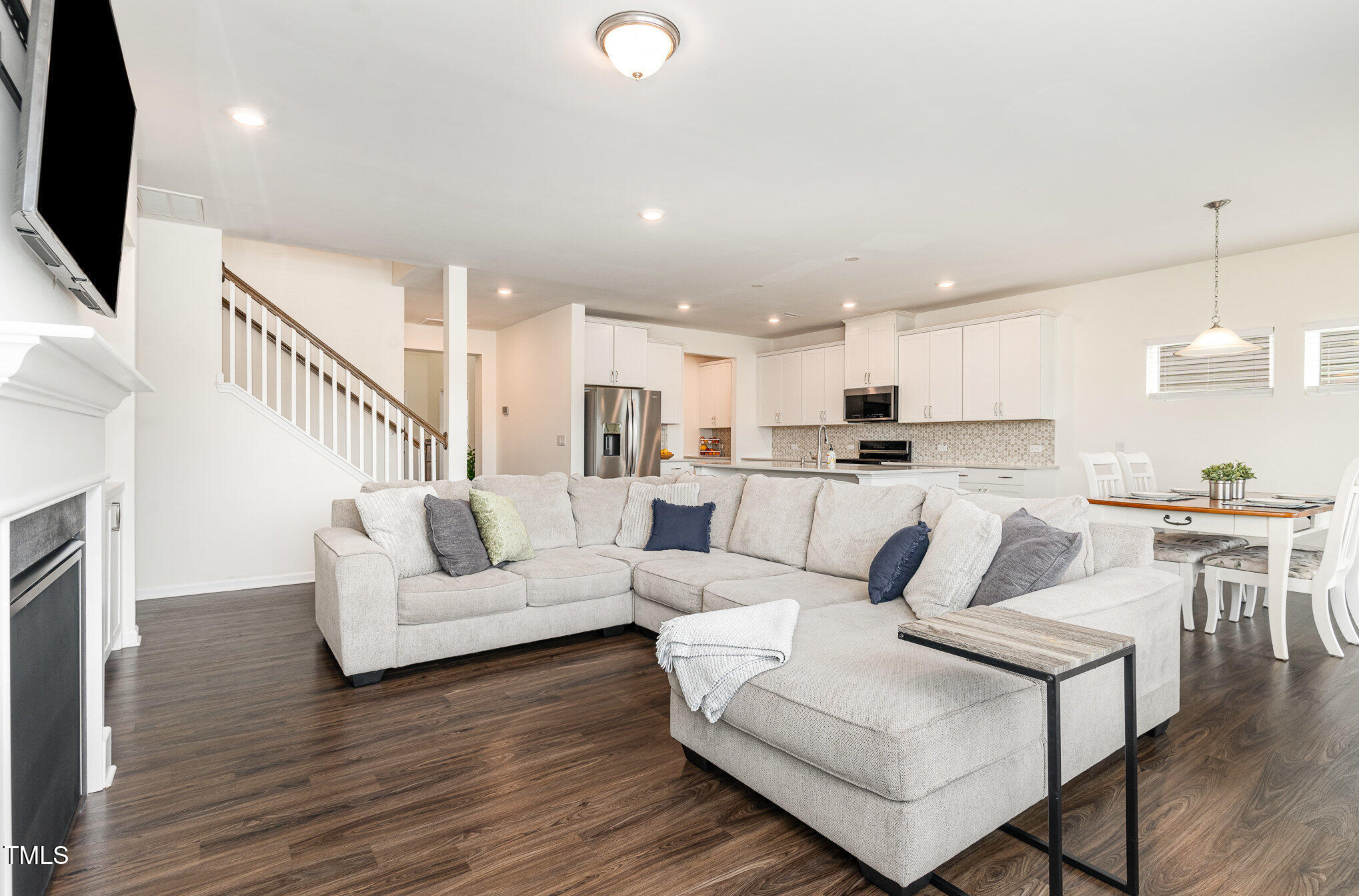 1040 Lippincott Road Durham, NC 27703 - Photo 3 of 43 a living room with furniture and a flat screen tv