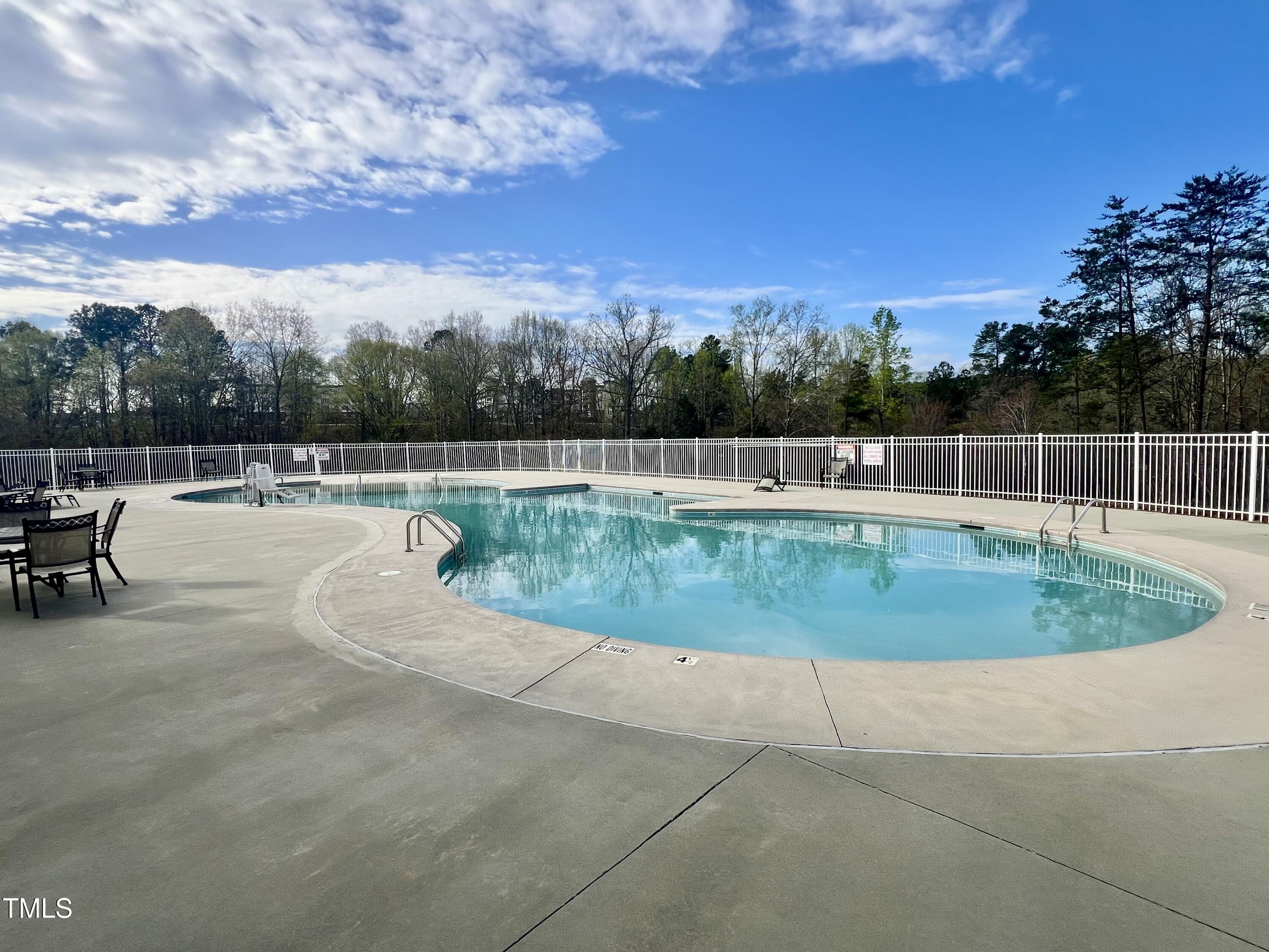 1040 Lippincott Road Durham, NC 27703 - Photo 36 of 43 a view of a swimming pool with a lawn chairs
